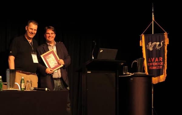 Righard Zwienenberg presenting Graham Cluley with an award at AVAR 2014